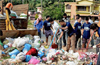 Third week, volunteers wield brooms, clean up many city spots